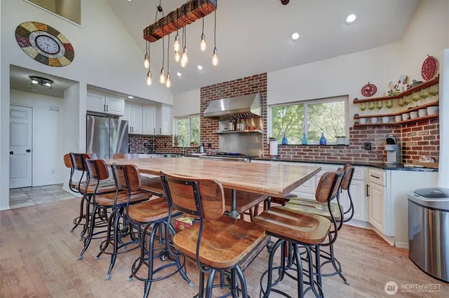 a kitchen with wooden cabinets and a stove top oven