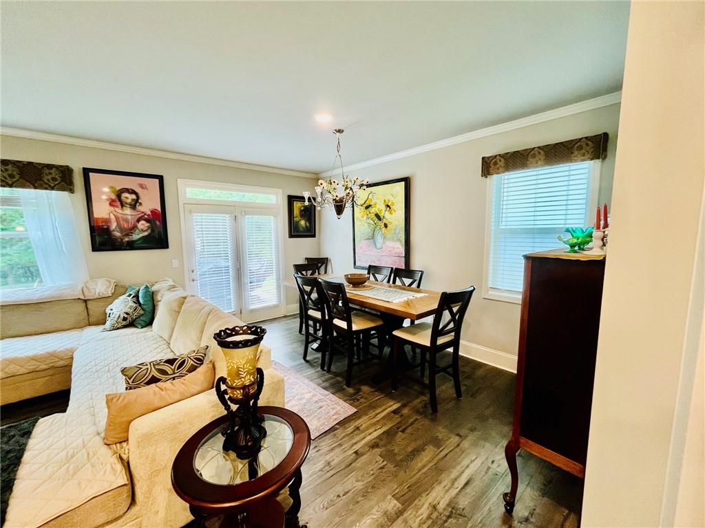 3015 Winding Ridge Waleska, GA 30183 - Photo 12 of 40 a living room with furniture a window and a dining table