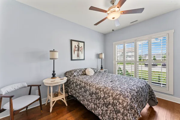 a bedroom with a bed and a table