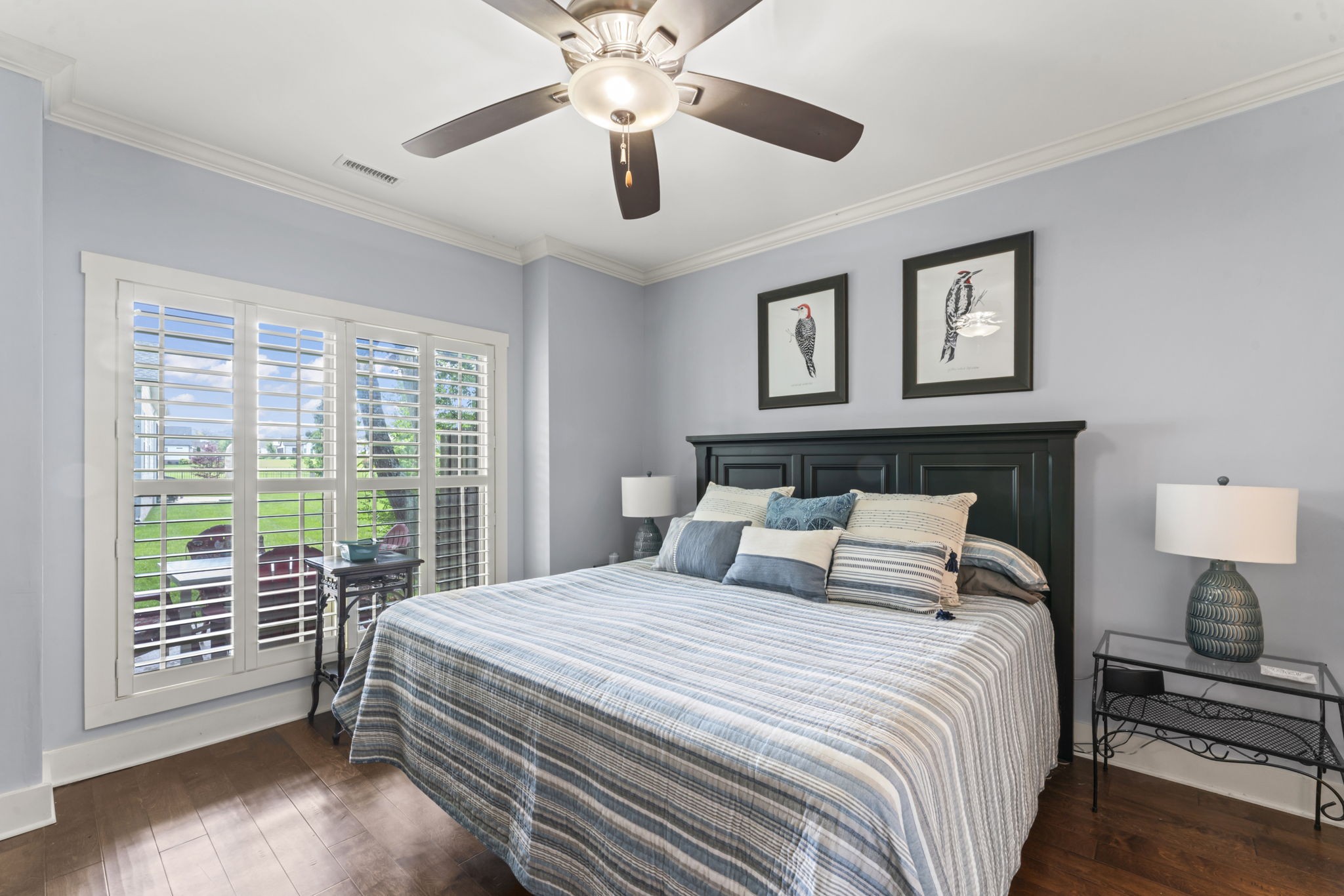 160 ANDERTON Drive Winchester, TN 37398 - Photo 27 of 41 a bedroom with a large bed and a chandelier next to a window