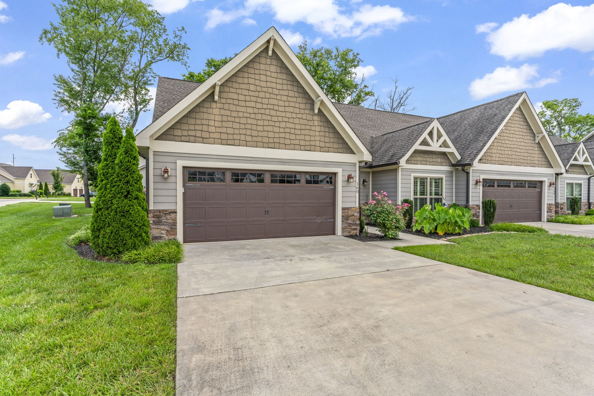 160 ANDERTON Drive Winchester, TN 37398 - Photo 5 of 41 a front view of a house with a yard and garage