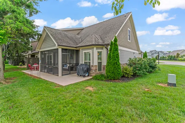 a view of a house with a yard porch and sitting area