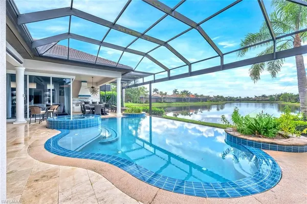 a view of a swimming pool with a patio