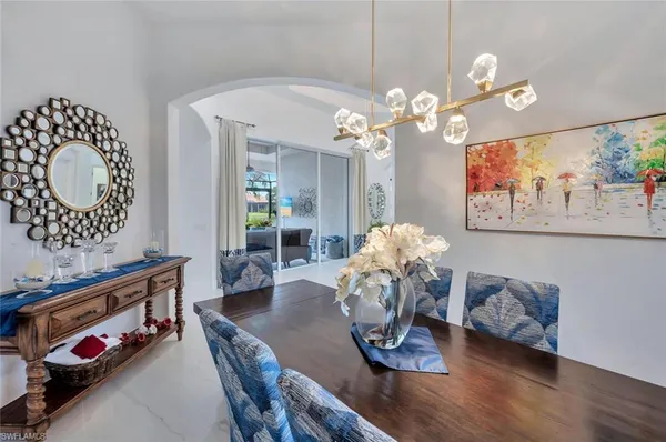 a dining room with furniture and wooden floor