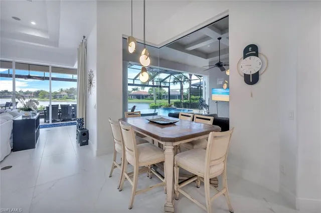 a large kitchen with a table and chairs