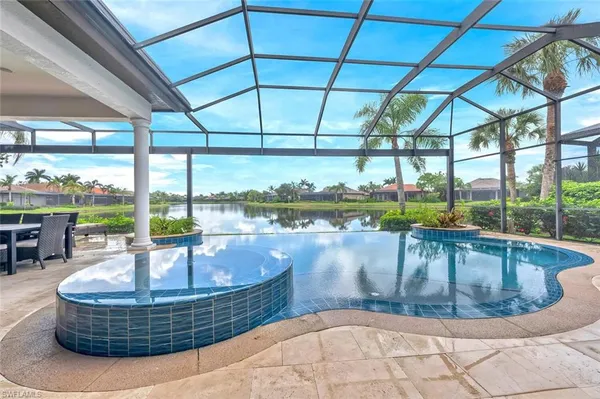 a view of a swimming pool with a patio