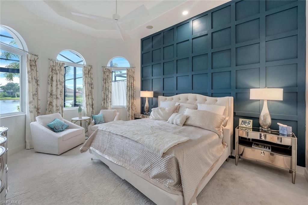 8957 Shenendoah Circle Naples, FL 34113 - Photo 28 of 50 a bedroom with a bed and a couch