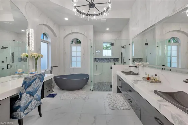 a bedroom with a bed a window and potted plant