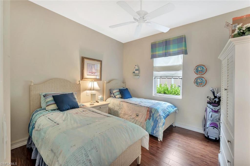8957 Shenendoah Circle Naples, FL 34113 - Photo 31 of 50 a bedroom with a bed a window and potted plant