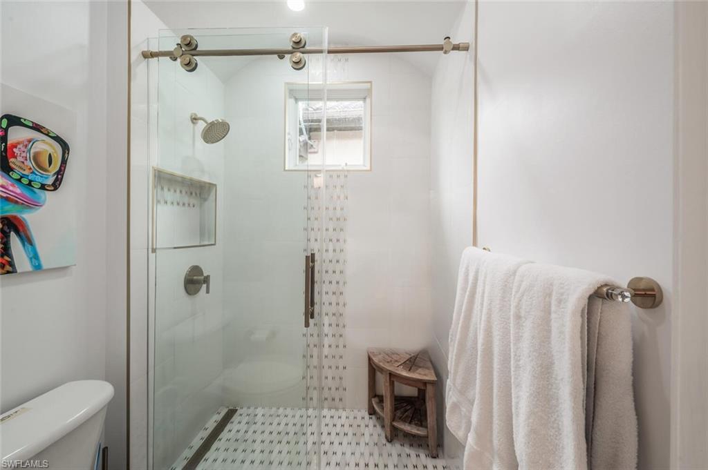 8957 Shenendoah Circle Naples, FL 34113 - Photo 33 of 50 a bathroom with a shower and a toilet
