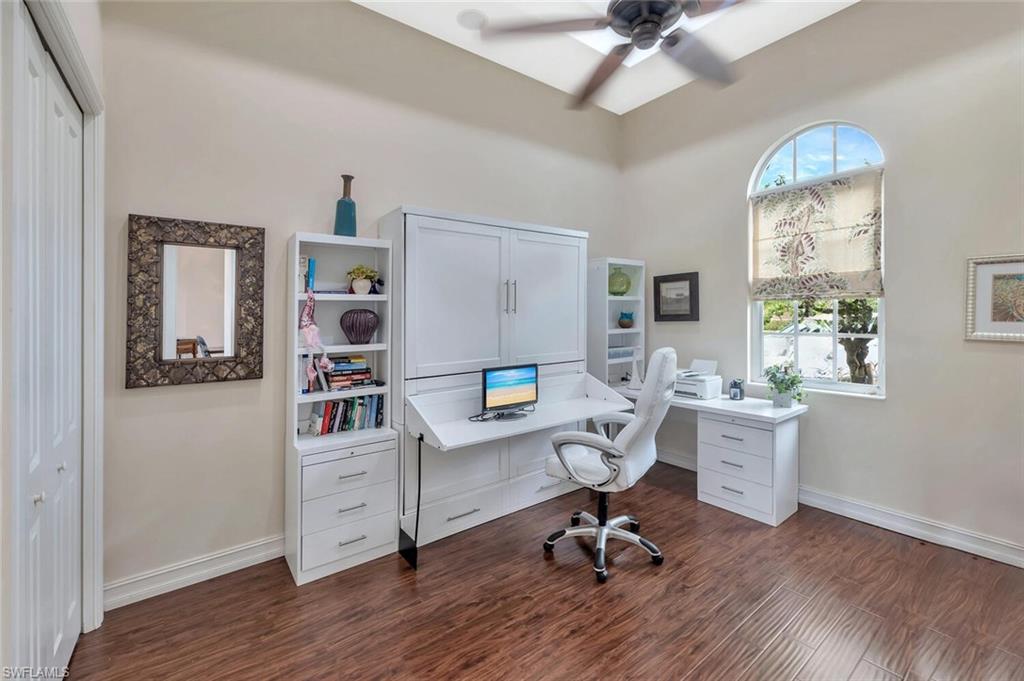 8957 Shenendoah Circle Naples, FL 34113 - Photo 35 of 50 a view of a workspace with furniture and a workspace