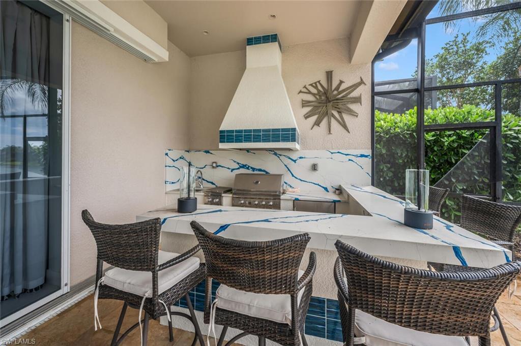 8957 Shenendoah Circle Naples, FL 34113 - Photo 39 of 50 a outdoor dining space with furniture and outdoor view