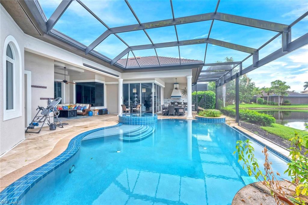 8957 Shenendoah Circle Naples, FL 34113 - Photo 40 of 50 a view of a swimming pool with a patio
