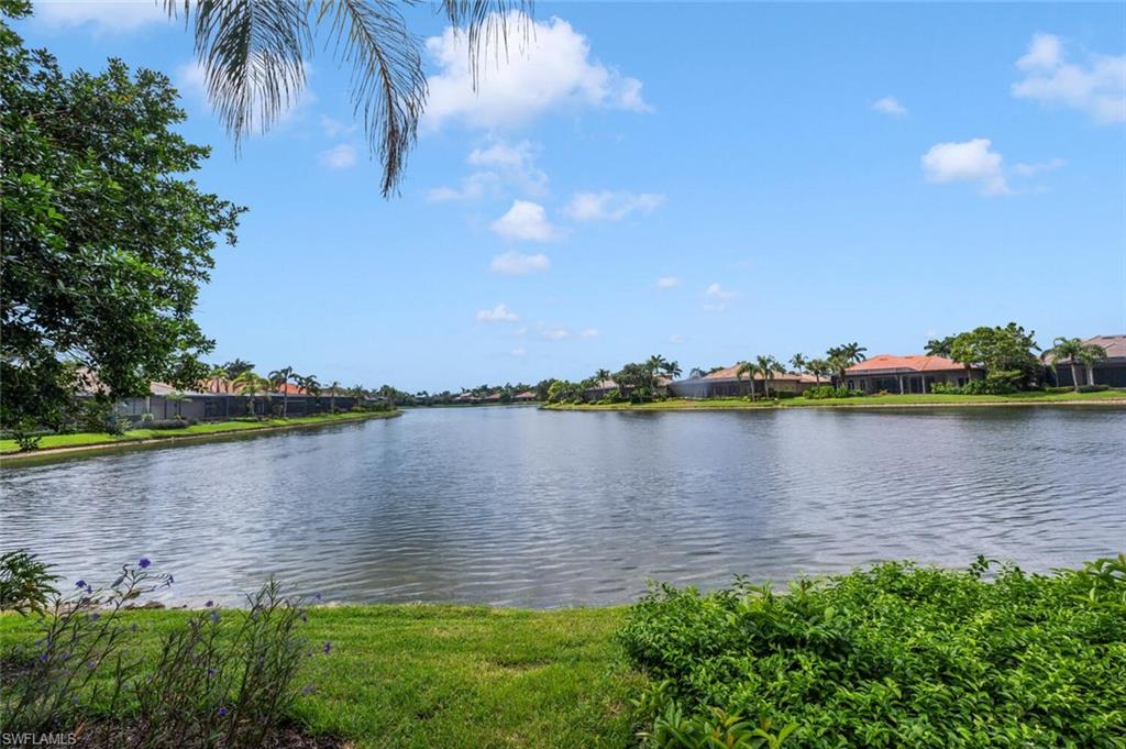 8957 Shenendoah Circle Naples, FL 34113 - Photo 42 of 50 a view of a lake from a yard