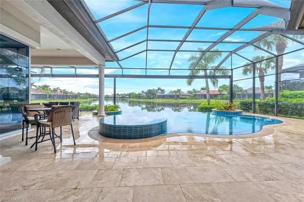 a view of a swimming pool with a patio