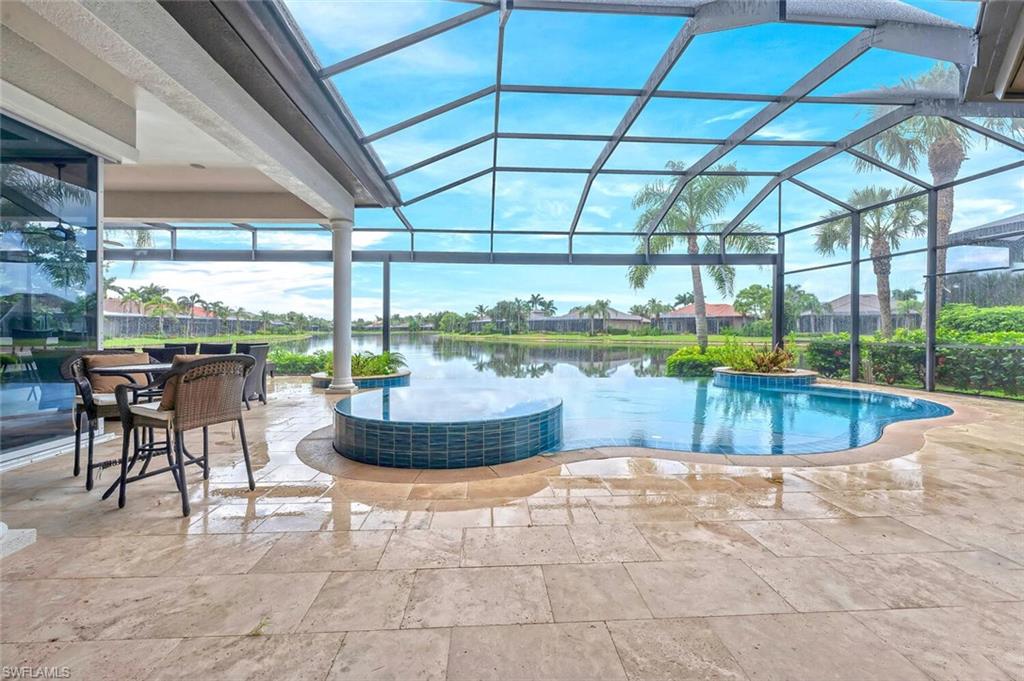 8957 Shenendoah Circle Naples, FL 34113 - Photo 7 of 50 a view of a swimming pool with a patio