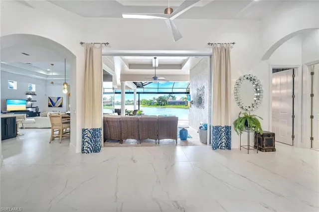 a view of a living room and entry way