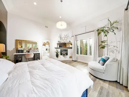 a kitchen with white cabinets white appliances sink and dishwasher