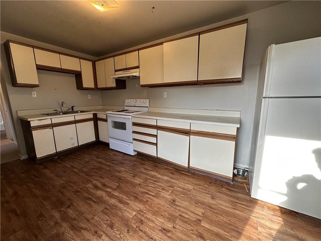 243 Pennsylvania Avenue Rochester, PA 15074 - Photo 2 of 18 a kitchen with stainless steel appliances granite countertop a stove a sink and a refrigerator