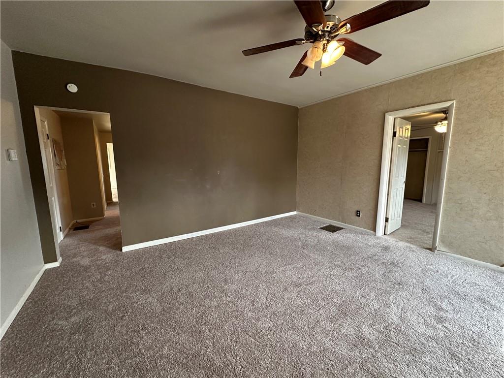 243 Pennsylvania Avenue Rochester, PA 15074 - Photo 6 of 18 an empty room with closet and a chandelier fan