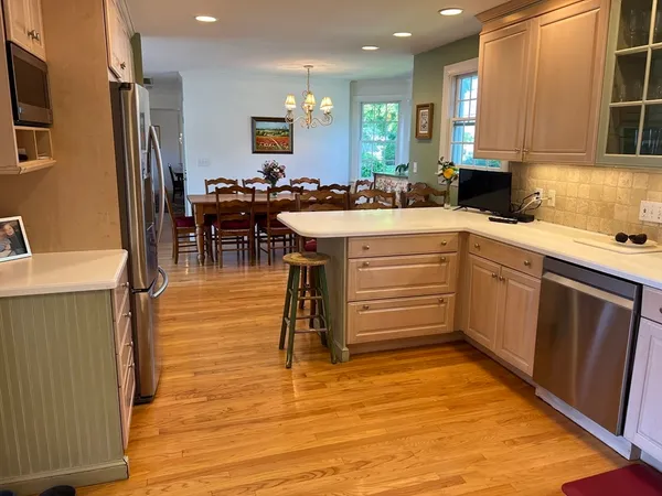 a kitchen with sink and cabinets