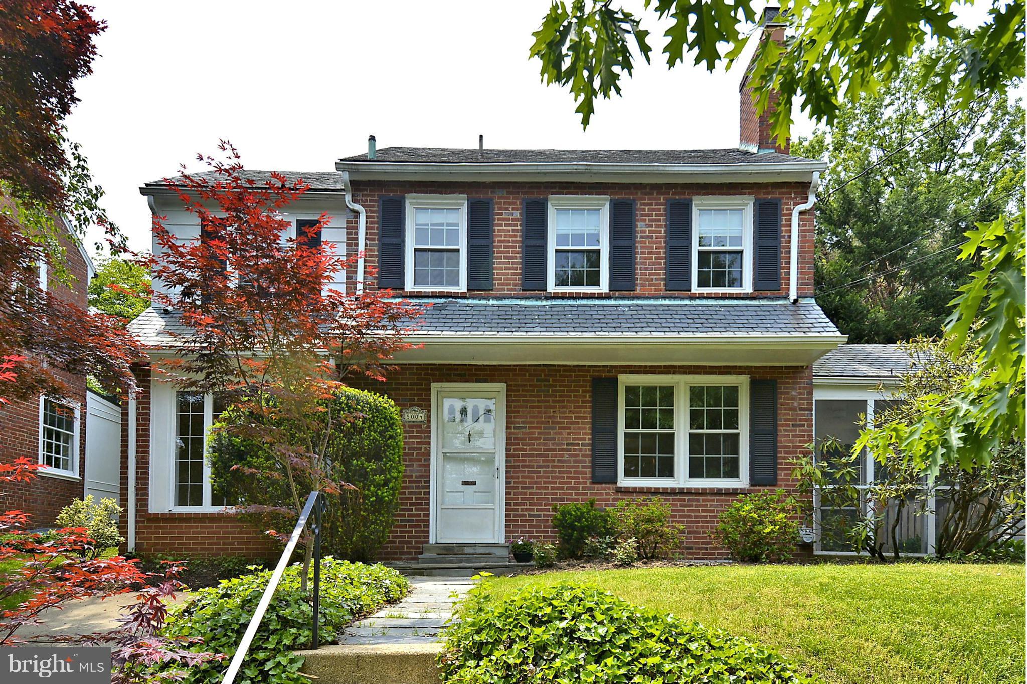 5004 Allan Road Bethesda, MD 20816 - Photo 1 of 30 a front view of a house with a yard and porch