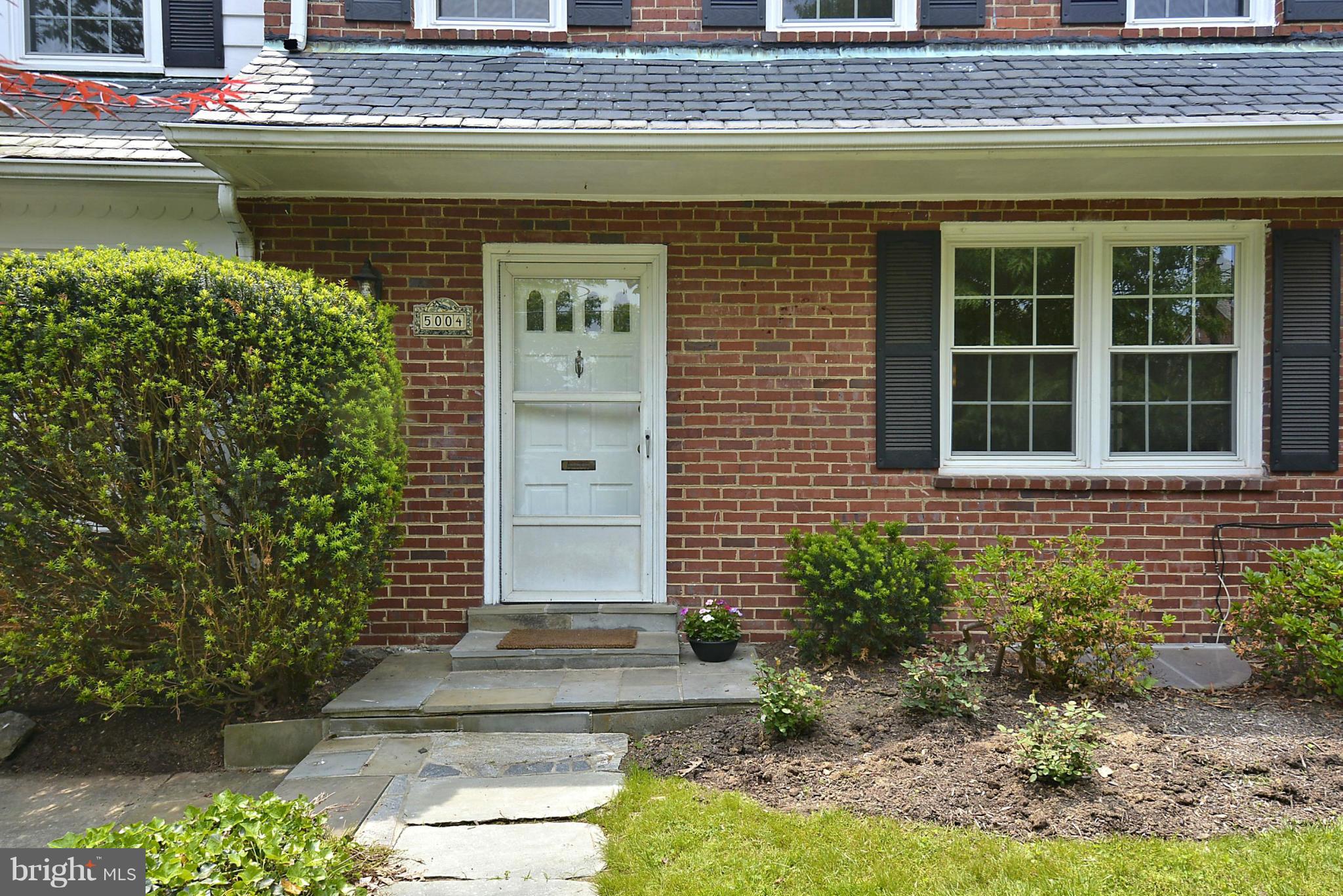 5004 Allan Road Bethesda, MD 20816 - Photo 2 of 30 a front view of a house with garden