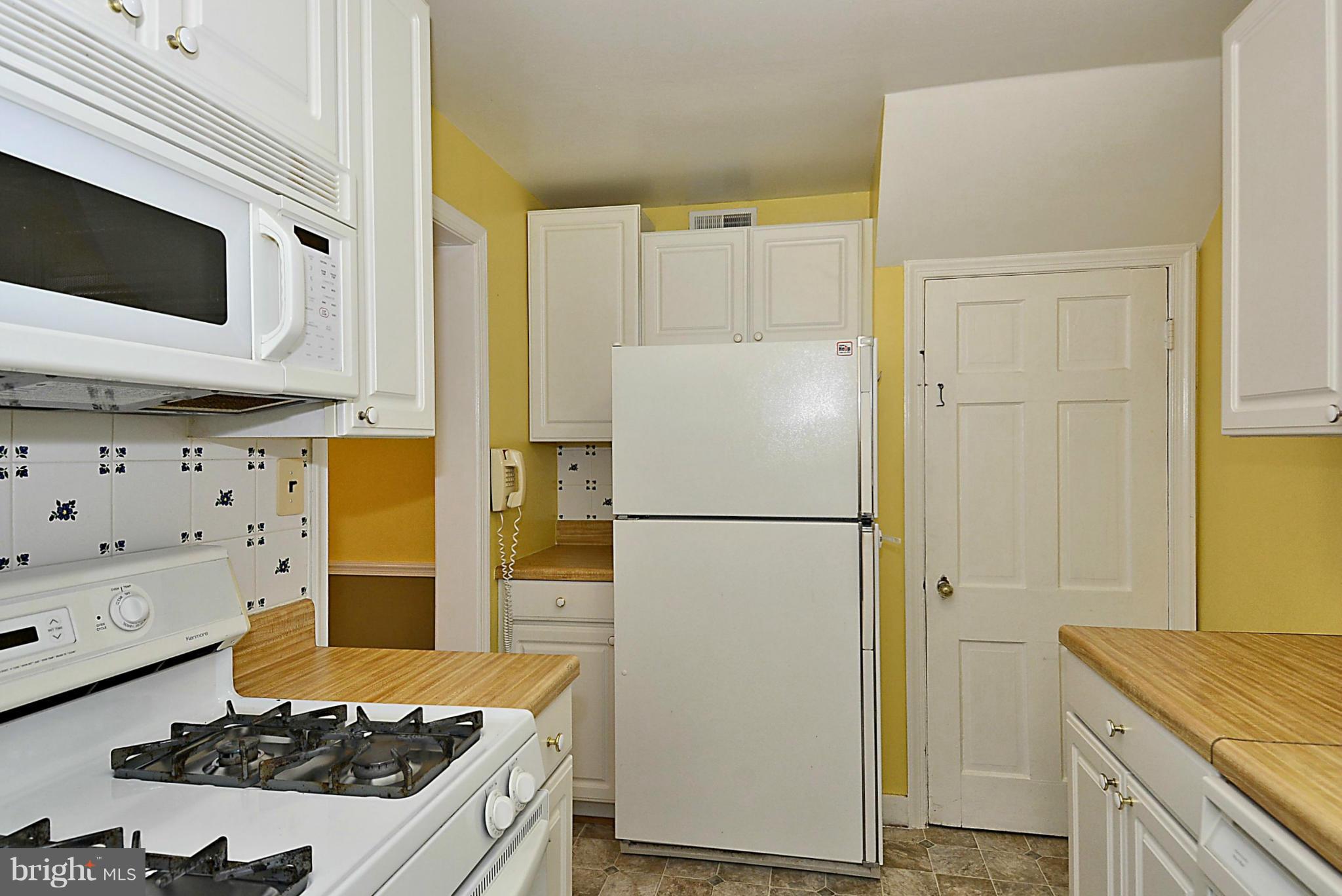 5004 Allan Road Bethesda, MD 20816 - Photo 12 of 30 a kitchen with a refrigerator and a stove