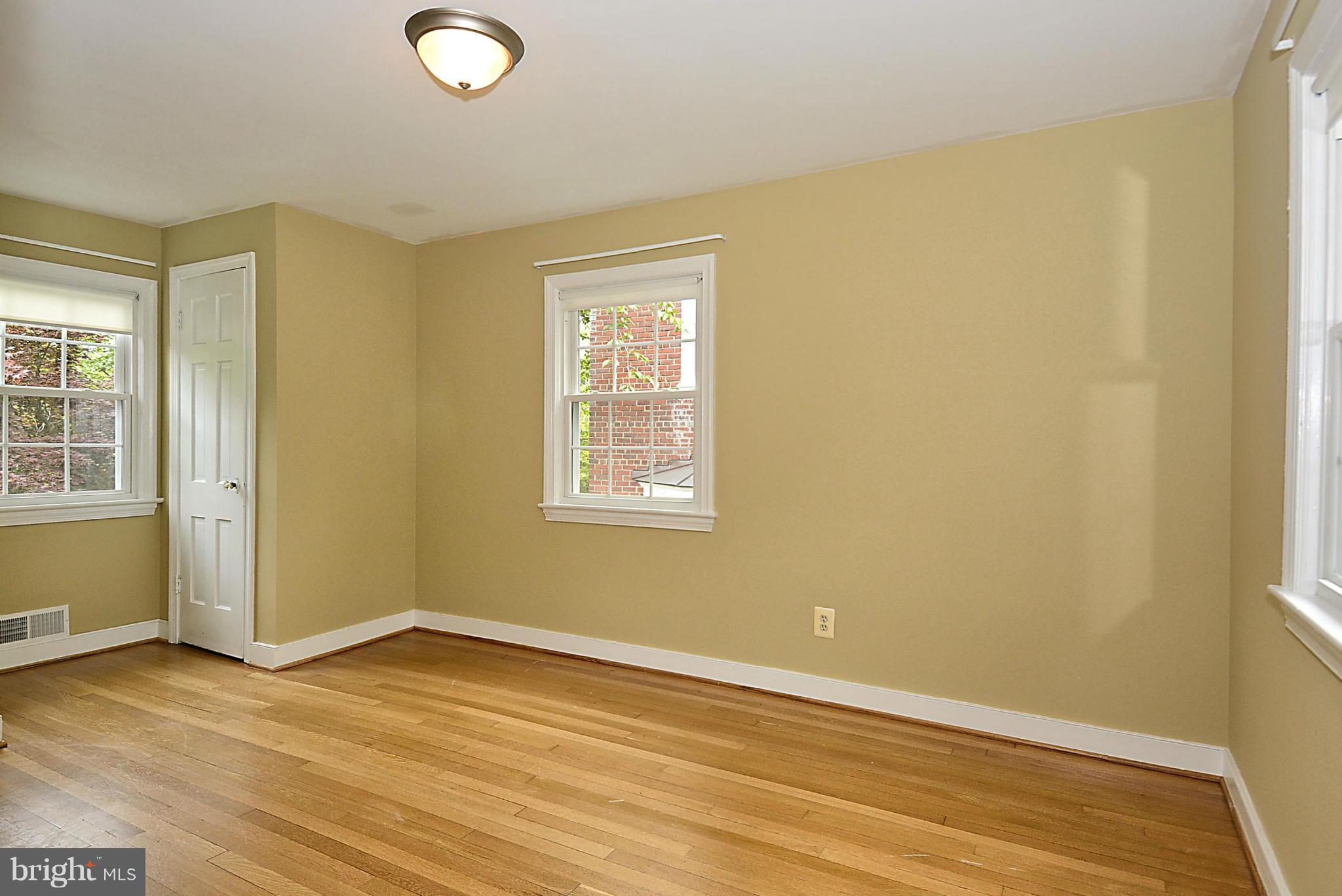 5004 Allan Road Bethesda, MD 20816 - Photo 16 of 30 an empty room with wooden floor and windows