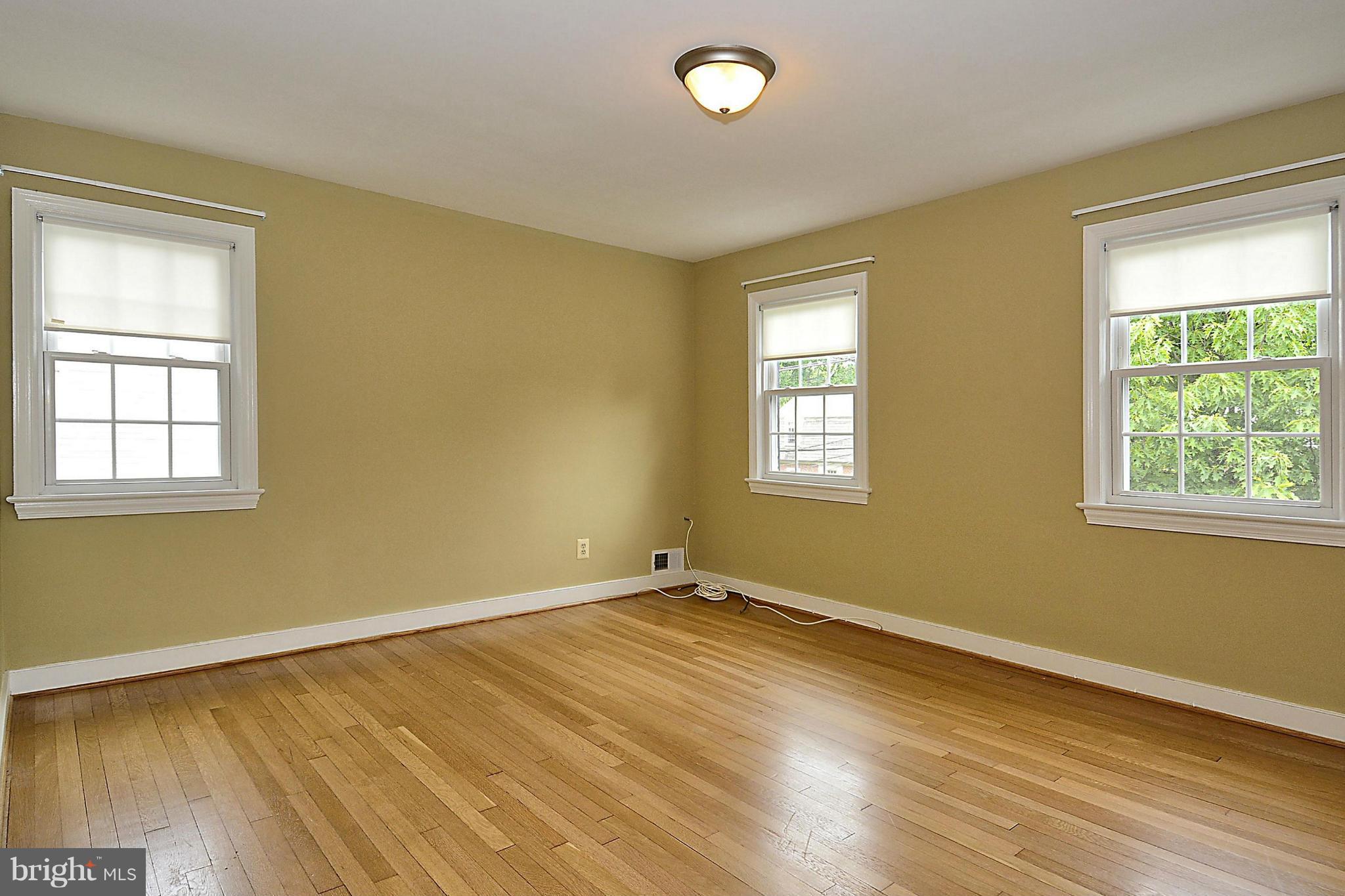 5004 Allan Road Bethesda, MD 20816 - Photo 17 of 30 a view of an empty room with wooden floor and a window