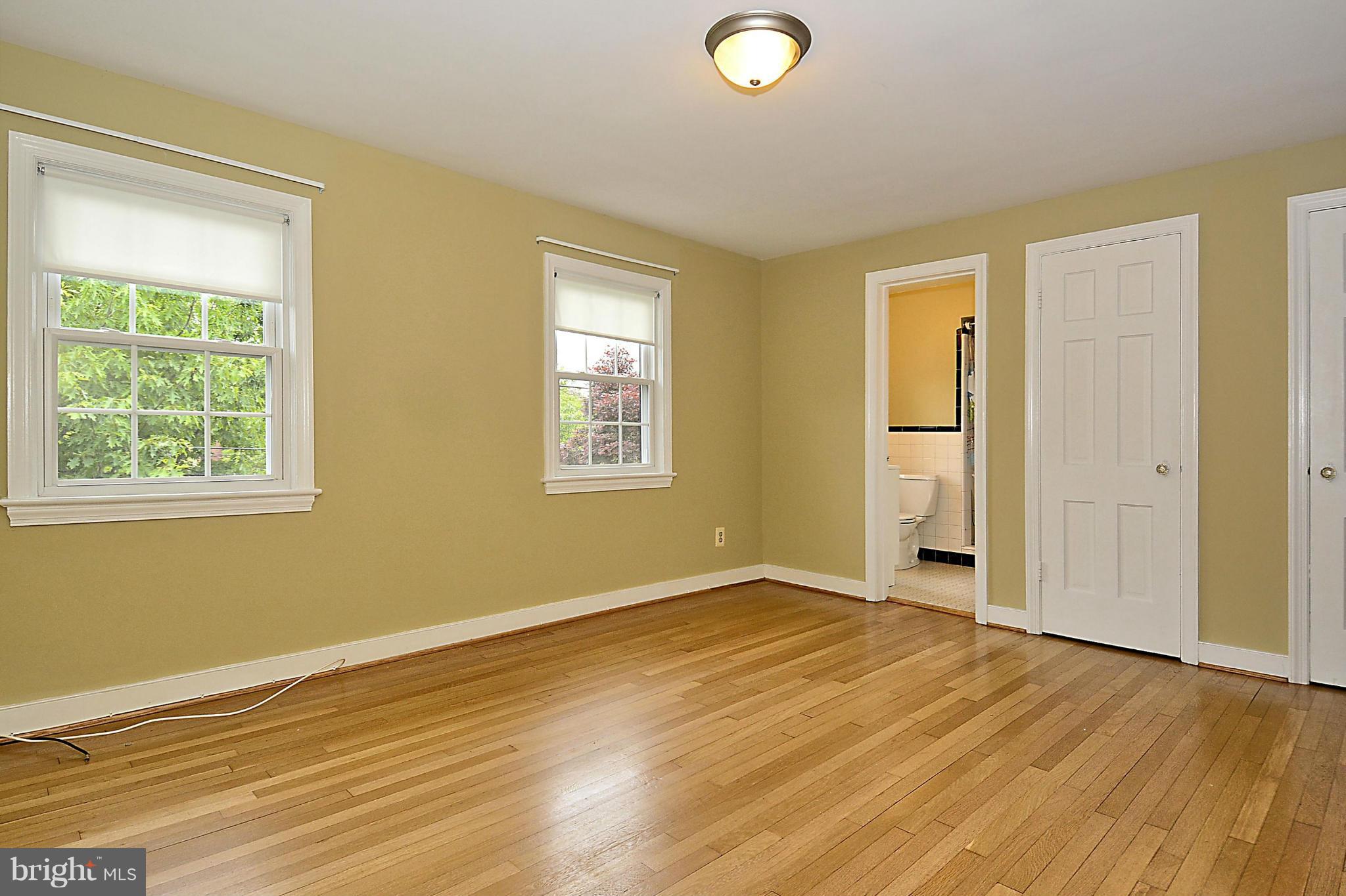 5004 Allan Road Bethesda, MD 20816 - Photo 18 of 30 a view of an empty room with wooden floor and a window
