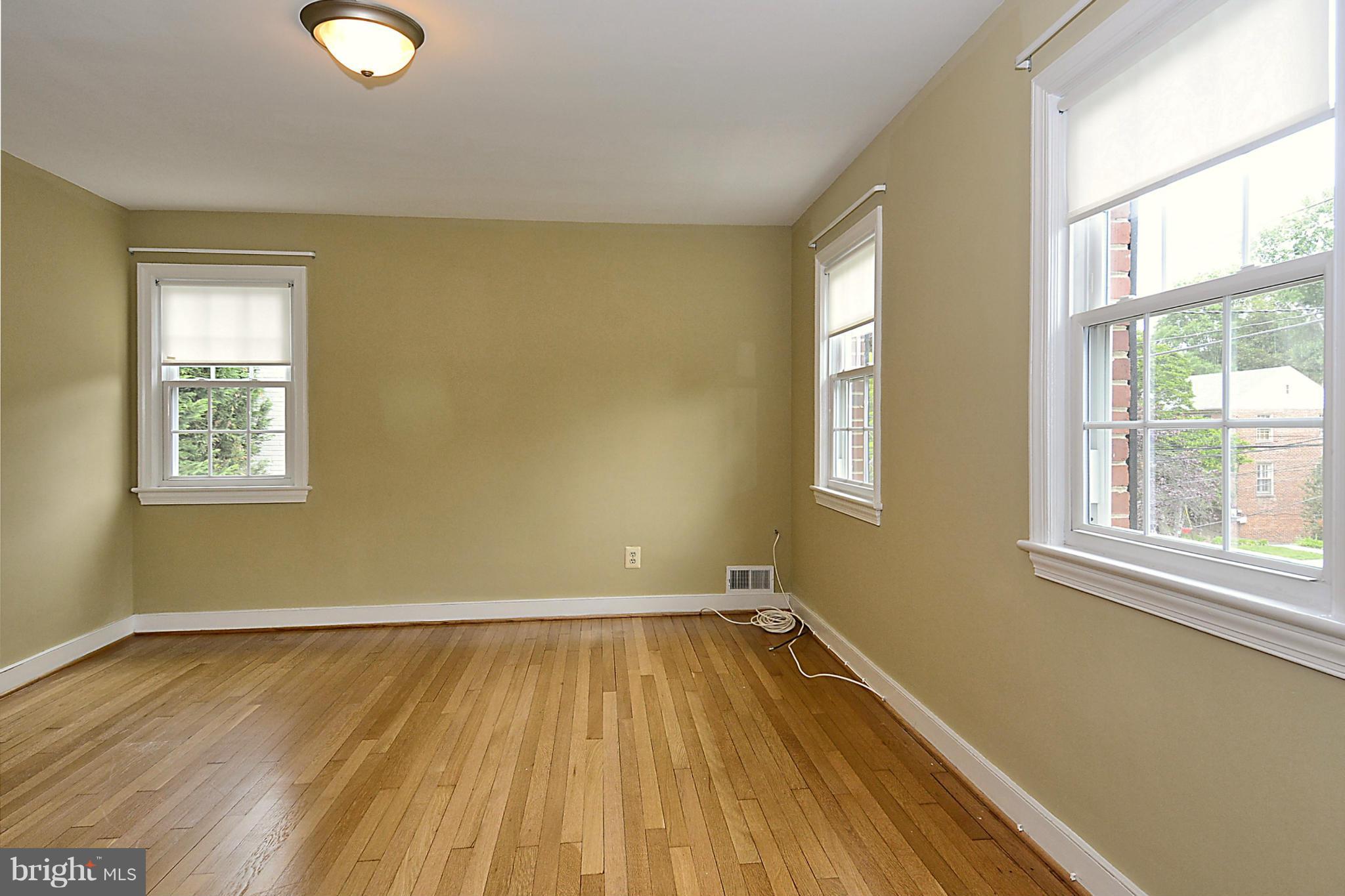 5004 Allan Road Bethesda, MD 20816 - Photo 19 of 30 a view of a room with wooden floor and windows