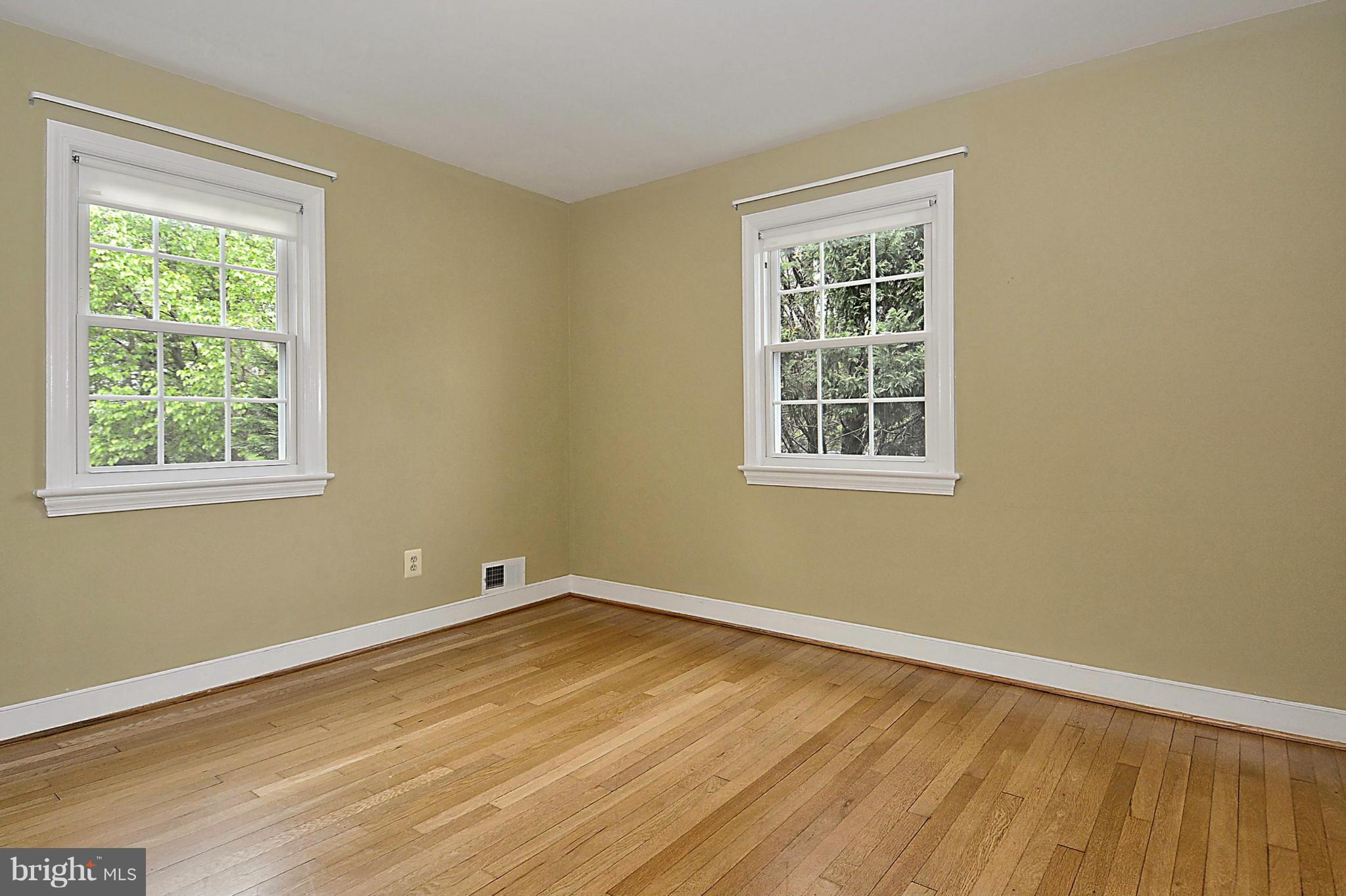 5004 Allan Road Bethesda, MD 20816 - Photo 20 of 30 a view of a room with wooden floor and windows
