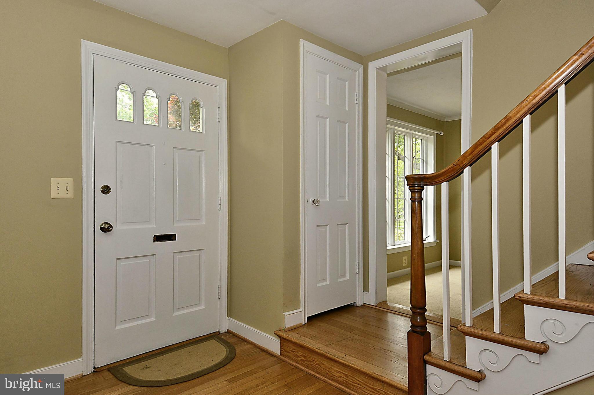 5004 Allan Road Bethesda, MD 20816 - Photo 3 of 30 a view of a hallway with wooden floor and staircase