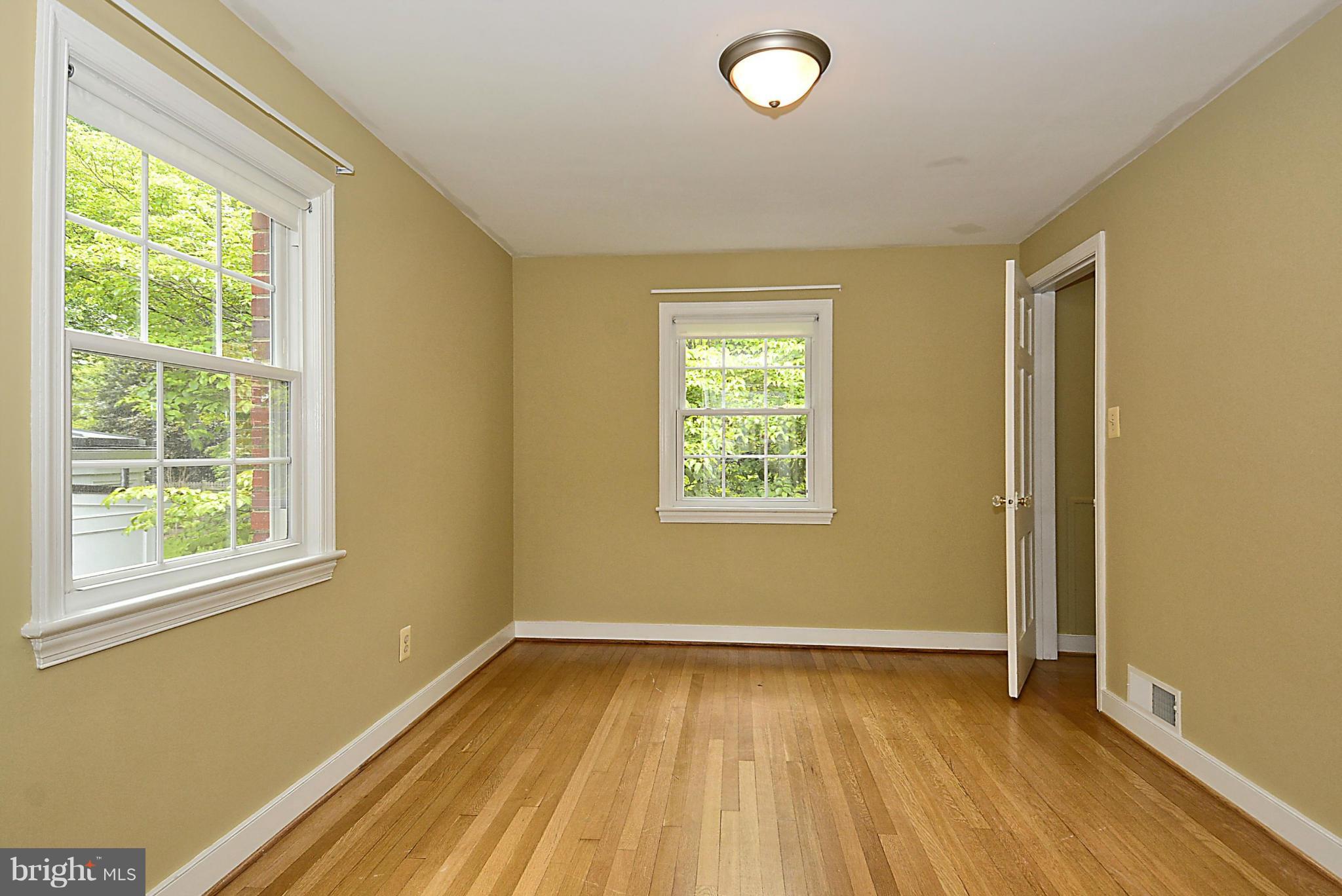 5004 Allan Road Bethesda, MD 20816 - Photo 21 of 30 a view of a room with wooden floor and windows
