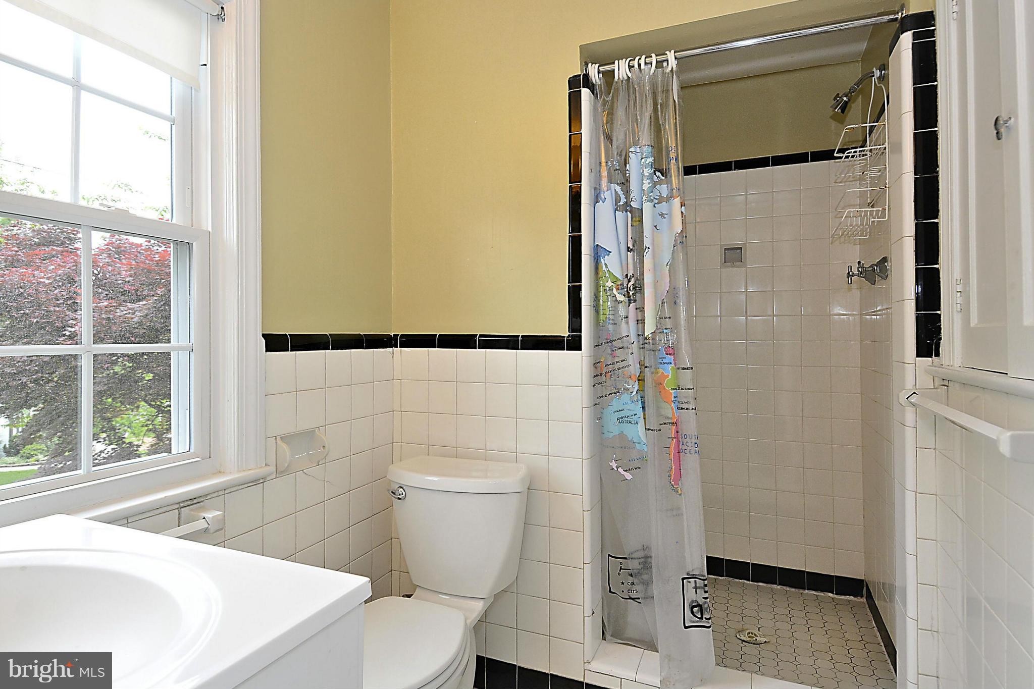 5004 Allan Road Bethesda, MD 20816 - Photo 22 of 30 a bathroom with a toilet and a shower