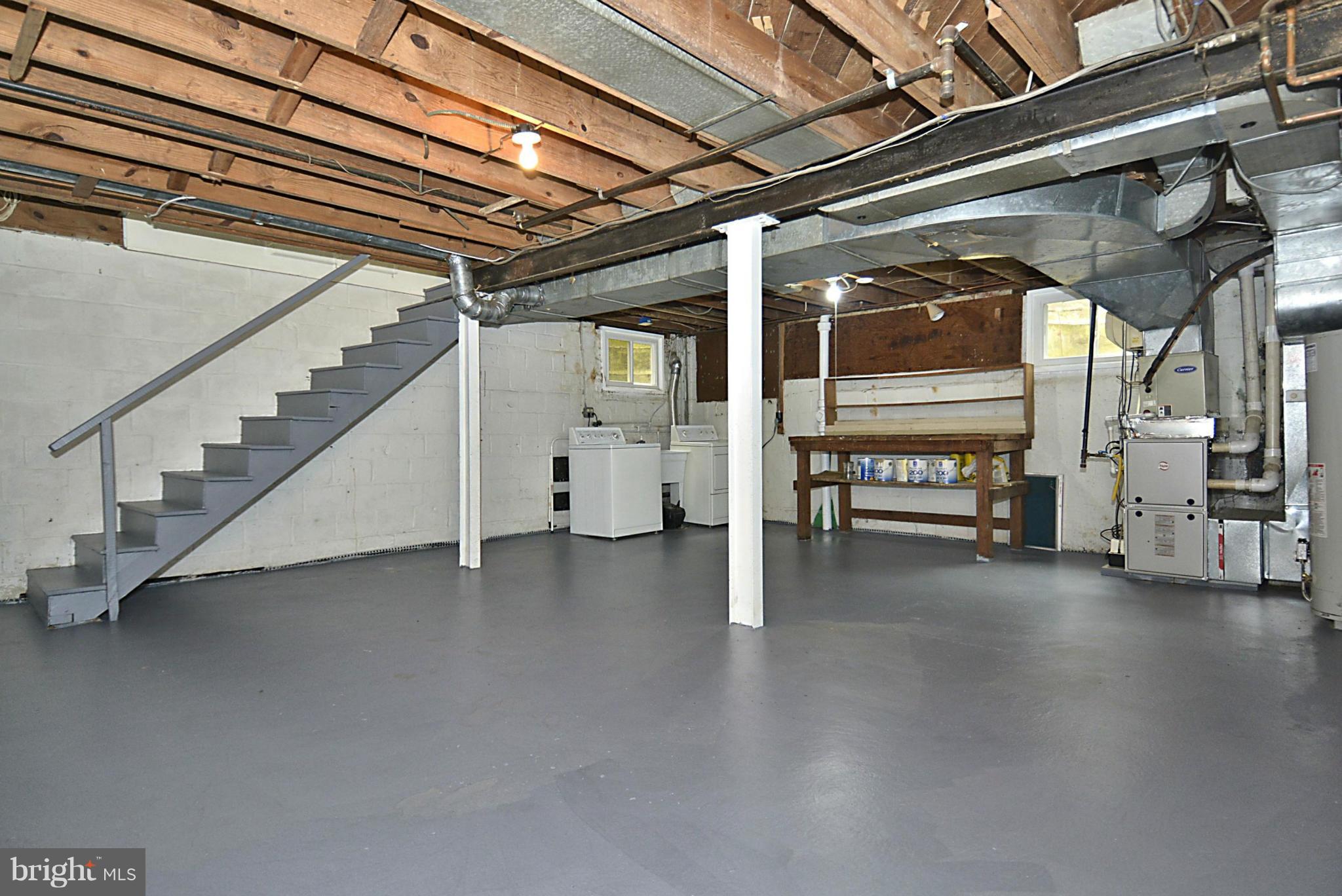 5004 Allan Road Bethesda, MD 20816 - Photo 24 of 30 a view of an empty room with stairs