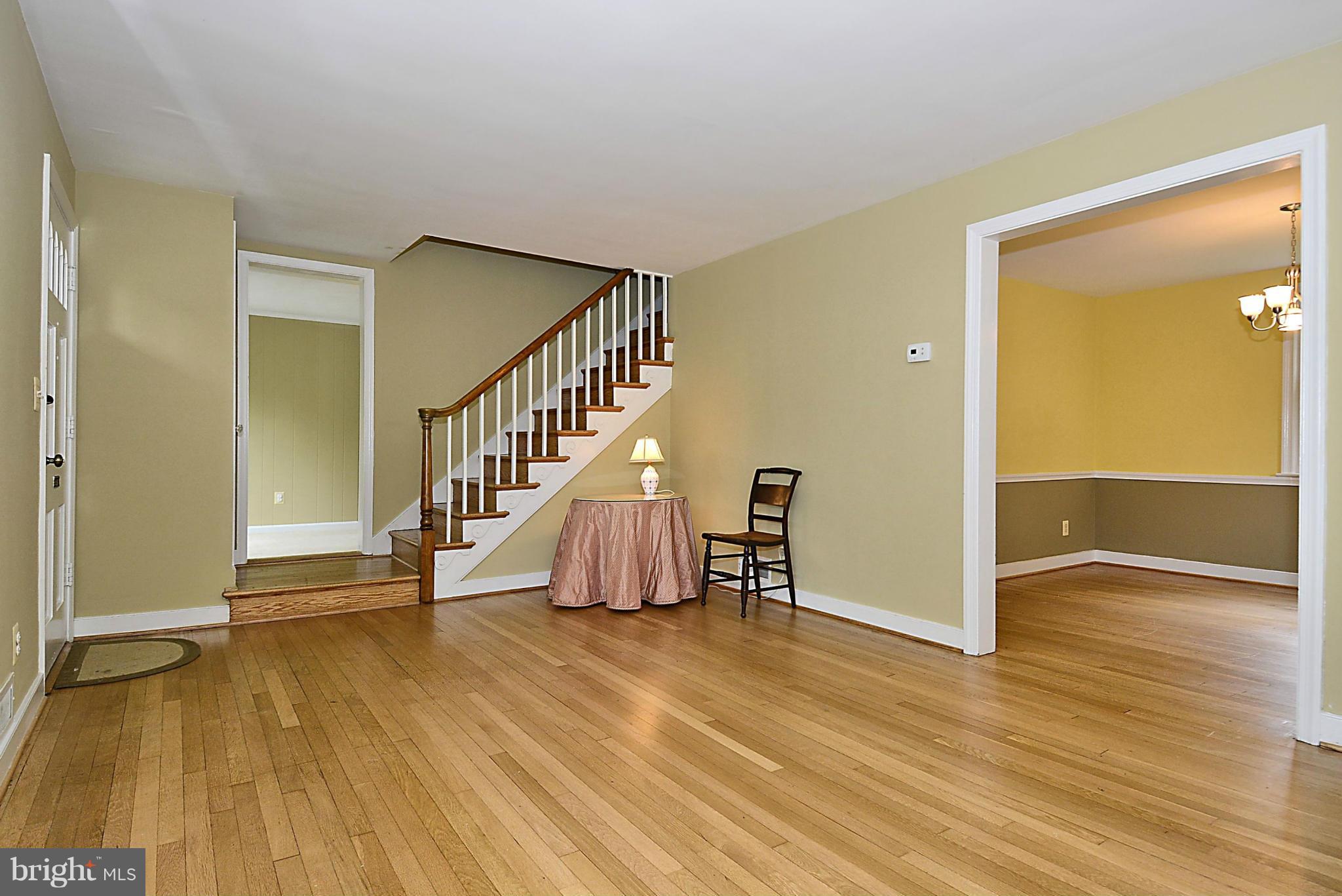 5004 Allan Road Bethesda, MD 20816 - Photo 6 of 30 a view of entryway with wooden floor and stairs