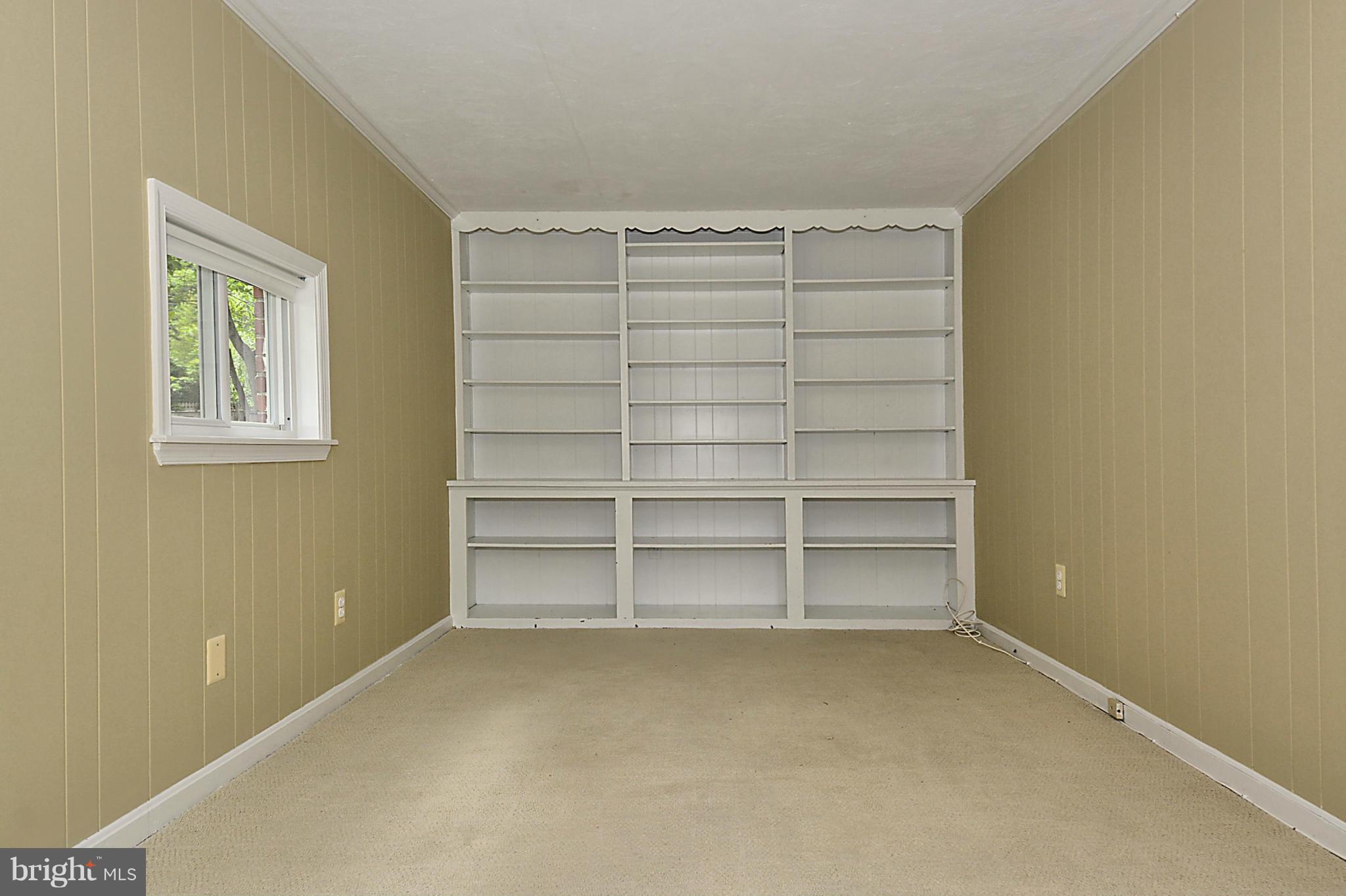 5004 Allan Road Bethesda, MD 20816 - Photo 10 of 30 a view of an empty room with a empty space and empty shelves