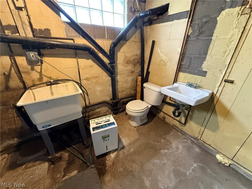 6784 Old Zoarville Road Northeast Dover, OH 44622 - Photo 40 of 50 Bathroom featuring toilet and unfinished concrete floors