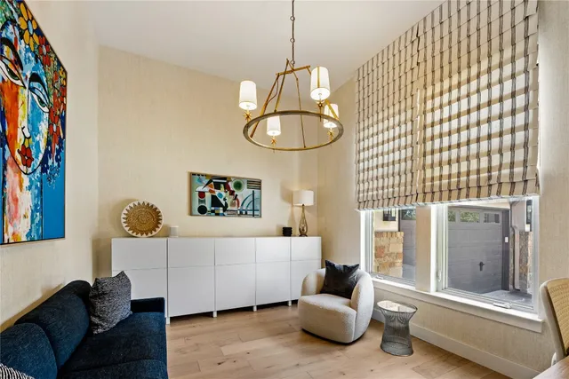 a bedroom with a bed and glass window