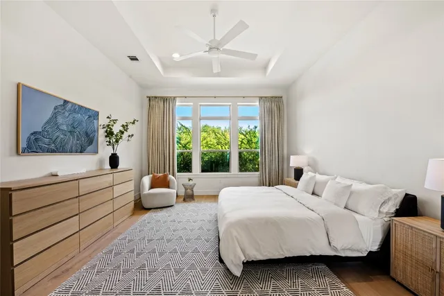 a bedroom with a large bed and a couch