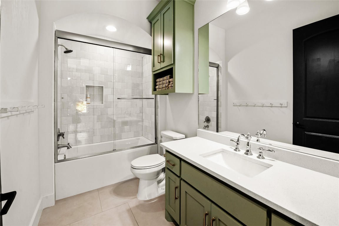 7909 Orisha Drive Austin, TX 78739 - Photo 20 of 40 a bathroom with a bathtub shower sink mirror and toilet