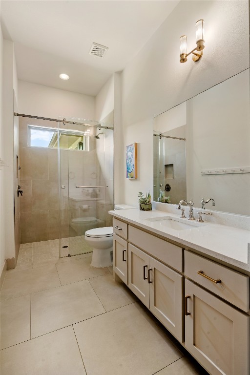 7909 Orisha Drive Austin, TX 78739 - Photo 23 of 40 a bathroom with a double vanity sink toilet and shower