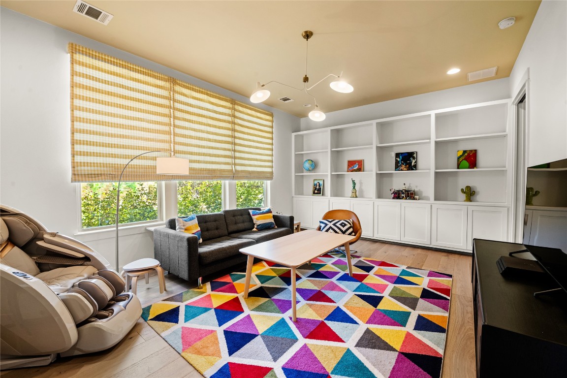 7909 Orisha Drive Austin, TX 78739 - Photo 24 of 40 a bedroom with furniture and a large window