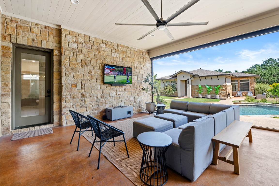 7909 Orisha Drive Austin, TX 78739 - Photo 26 of 40 a outdoor living space with furniture and a flat screen tv