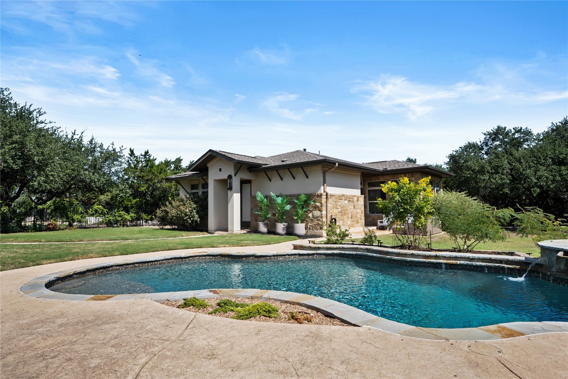 7909 Orisha Drive Austin, TX 78739 - Photo 27 of 40 a view of swimming pool and trees in the background