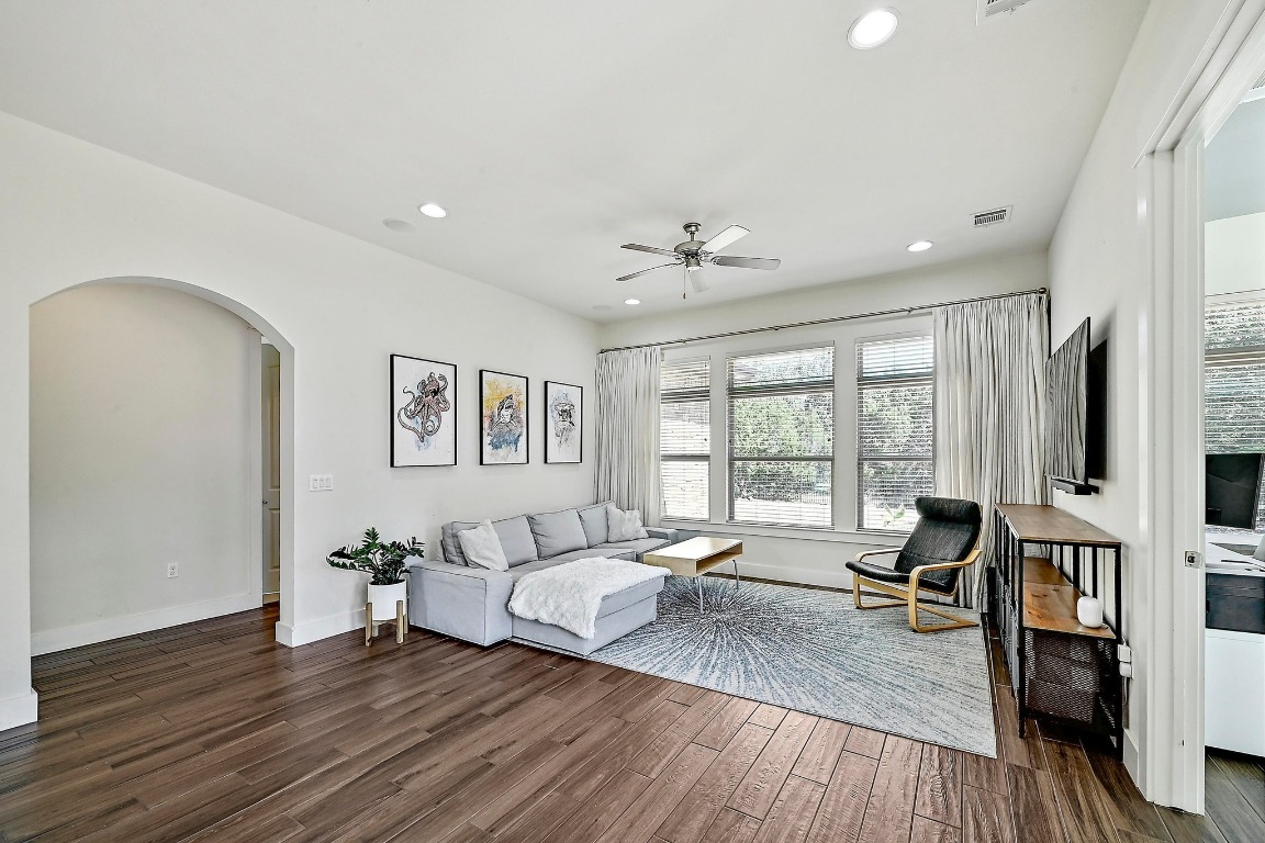 7909 Orisha Drive Austin, TX 78739 - Photo 29 of 40 a spacious bedroom with a large bed and a window