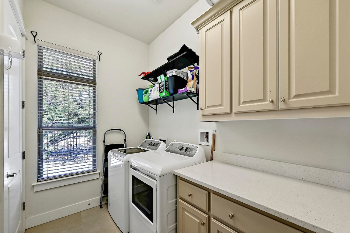 7909 Orisha Drive Austin, TX 78739 - Photo 36 of 40 a kitchen with a sink and cabinets