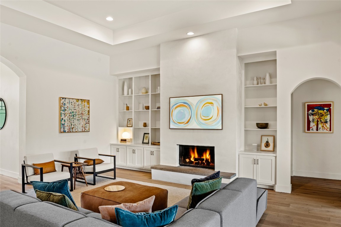 7909 Orisha Drive Austin, TX 78739 - Photo 5 of 40 a living room with furniture and a fireplace